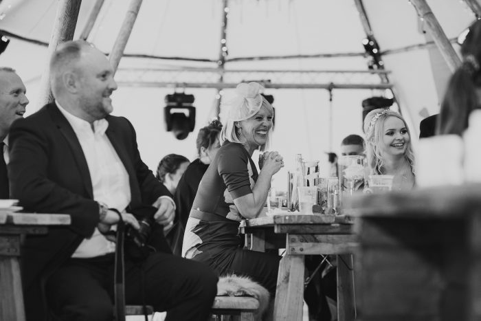 guests listening to speeches inside tipi at boho wedding, London wedding photography, Romantic London wedding, beautiful London wedding venue, Bride and groom London, London wedding photography inspiration, Elegant London wedding photos, Stylish London wedding portraits, London wedding photography packages, Chic London wedding photography, London wedding photography services London wedding photographer capturing love in the city, Elegant and romantic wedding photography in London, Beautiful bridal portraits in iconic London locations, London wedding photographer creating timeless memories, Stylish and sophisticated wedding photography in London, Breathtaking images of love and celebration in London, Award-winning wedding photography in the heart of London, London's top wedding photographer capturing your special day, Chic and modern wedding photography in London, Unforgettable moments captured by a London wedding photographer