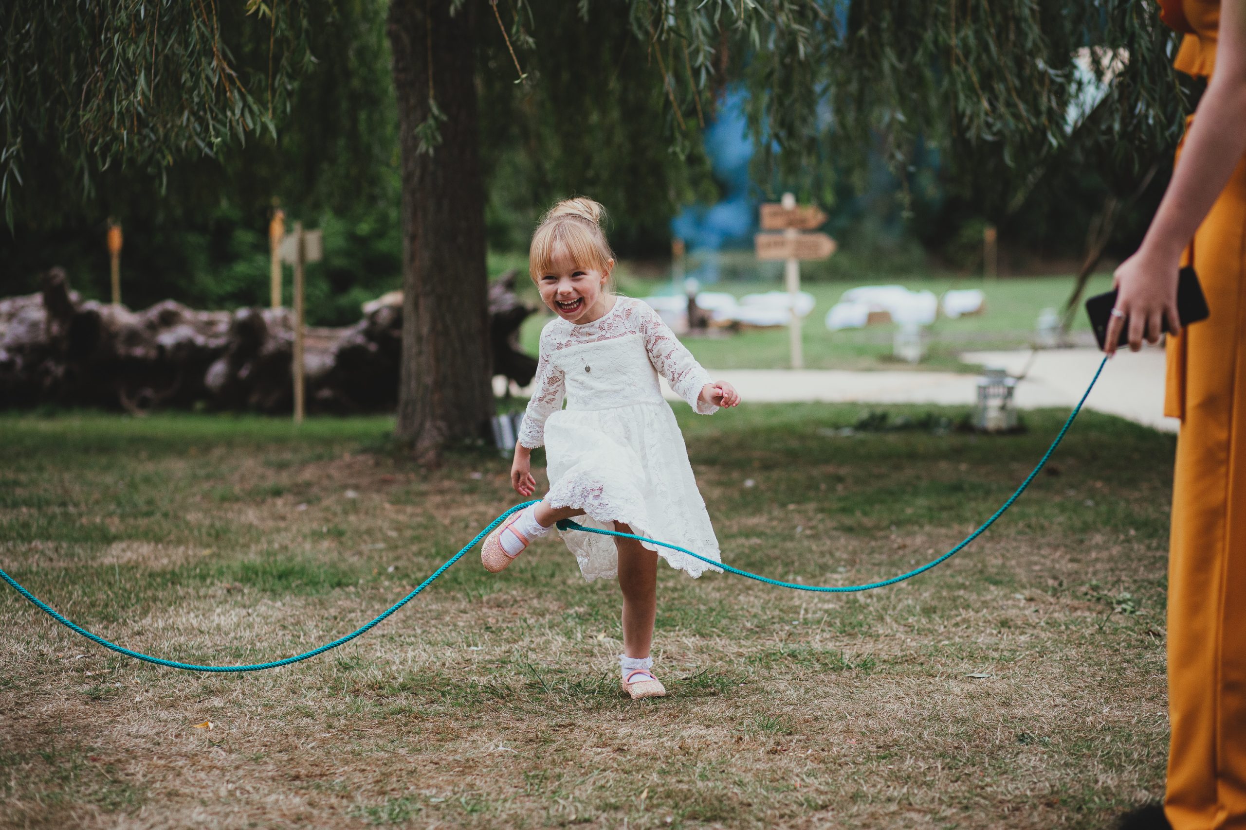 girl playing with outdoor wedding lawn games