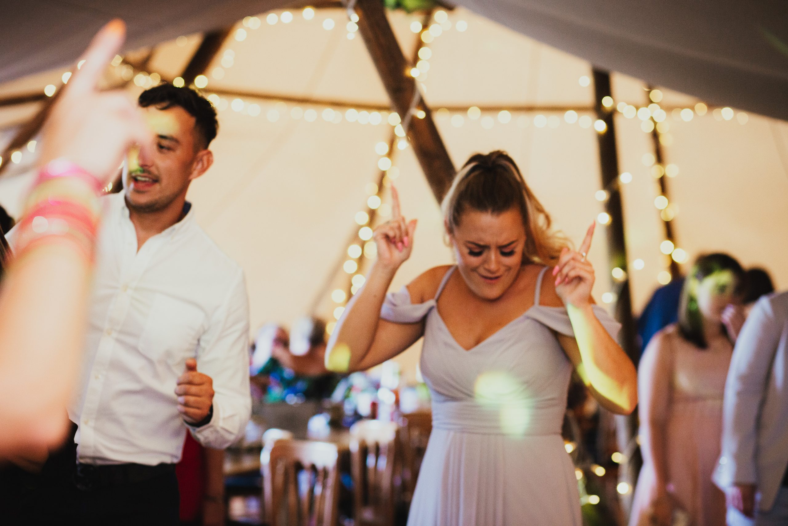 dancing in tipi at festival wedding