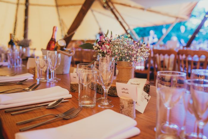 table decoration inside tipi at festival wedding