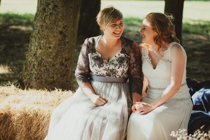 bride and bride at outdoor, boho wedding on haystack