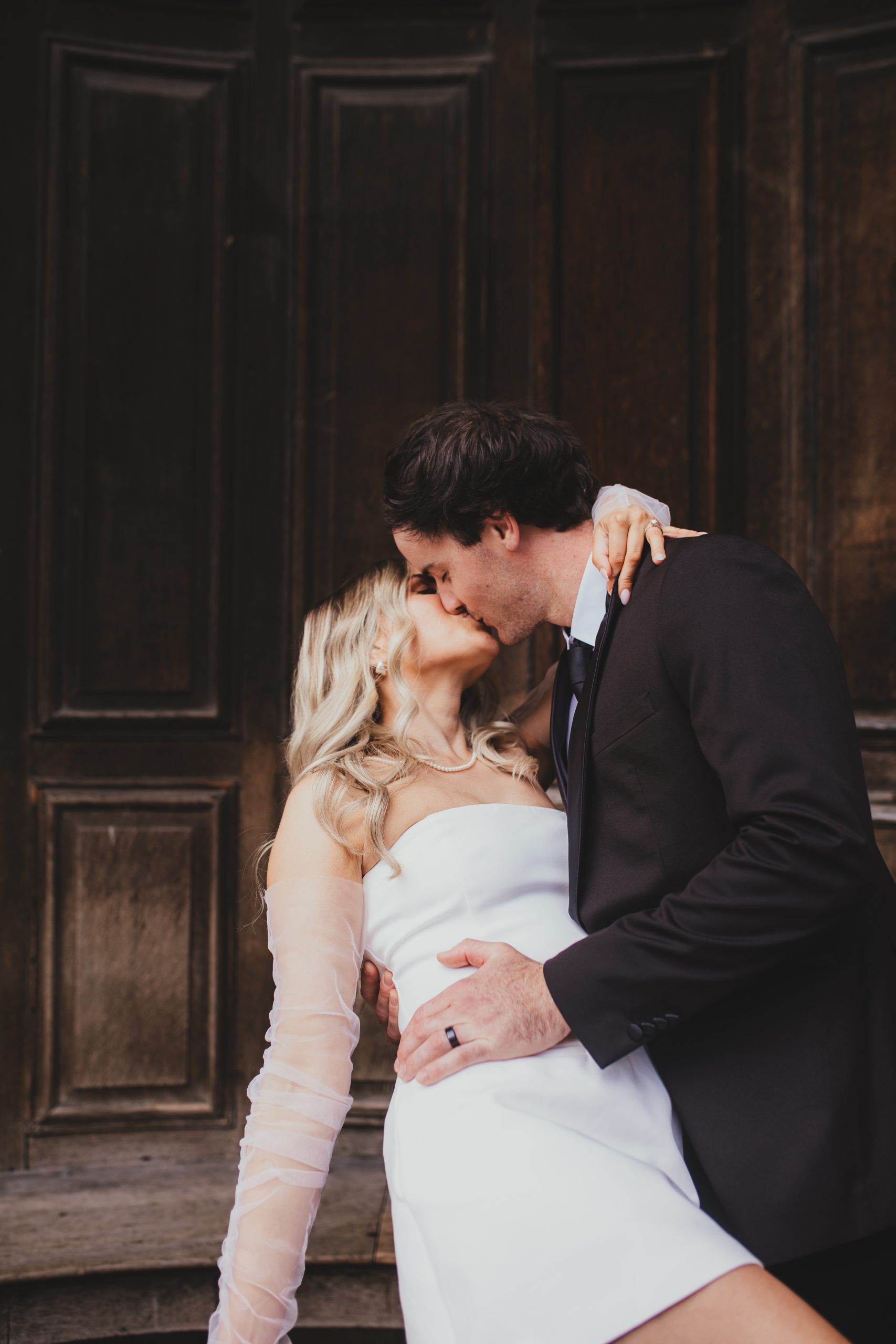 Couple framed in an archway, romantic London elopement portrait