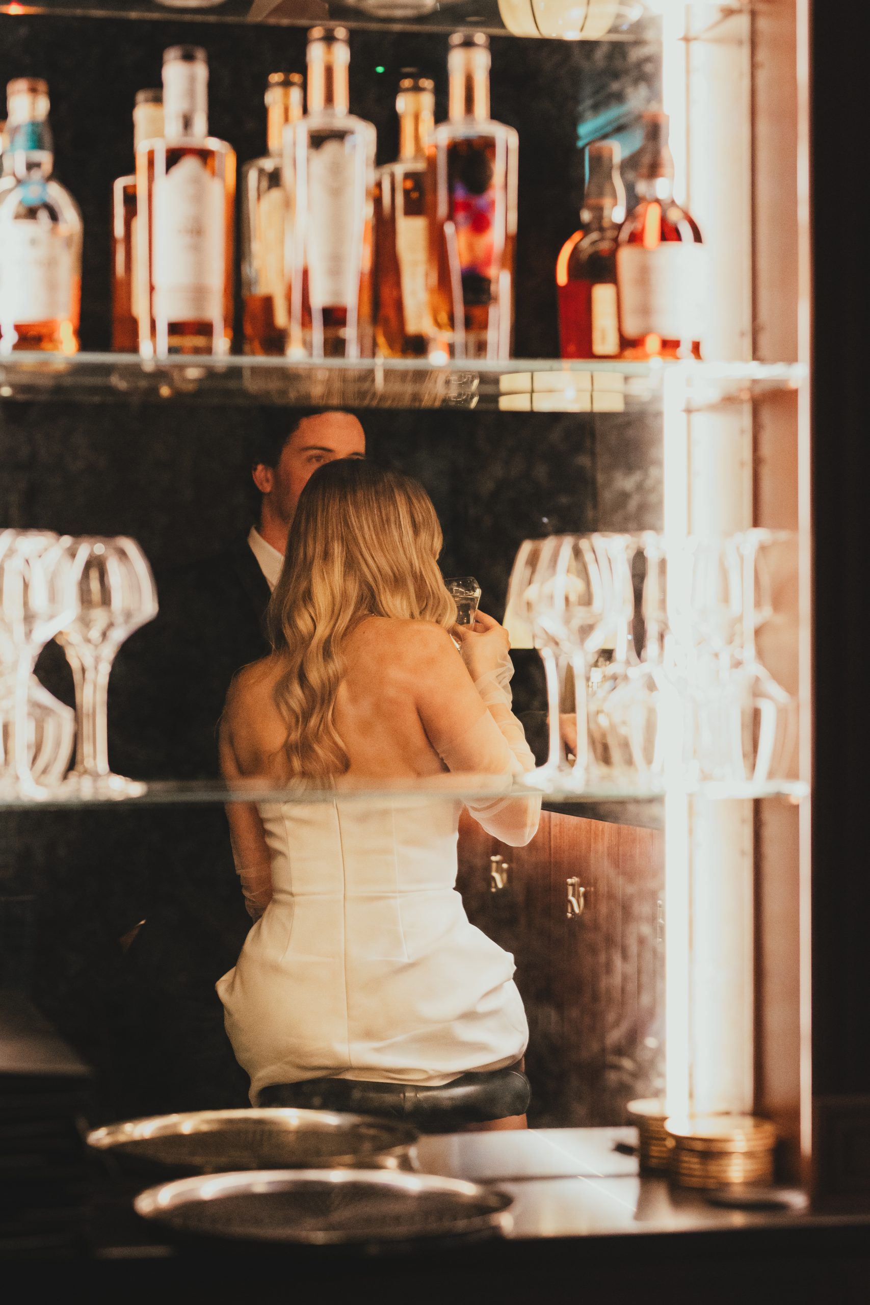 Bride and groom at the bar, warm and romantic London celebration