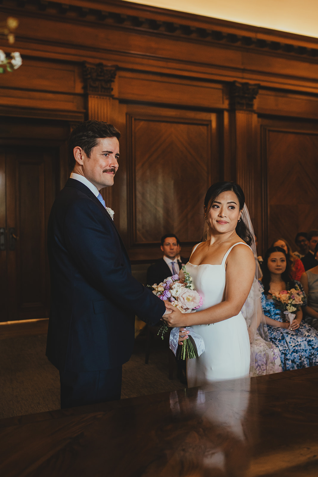 Bride and groom exchanging vows in the Westminster Room, Old Marylebone Town Hall