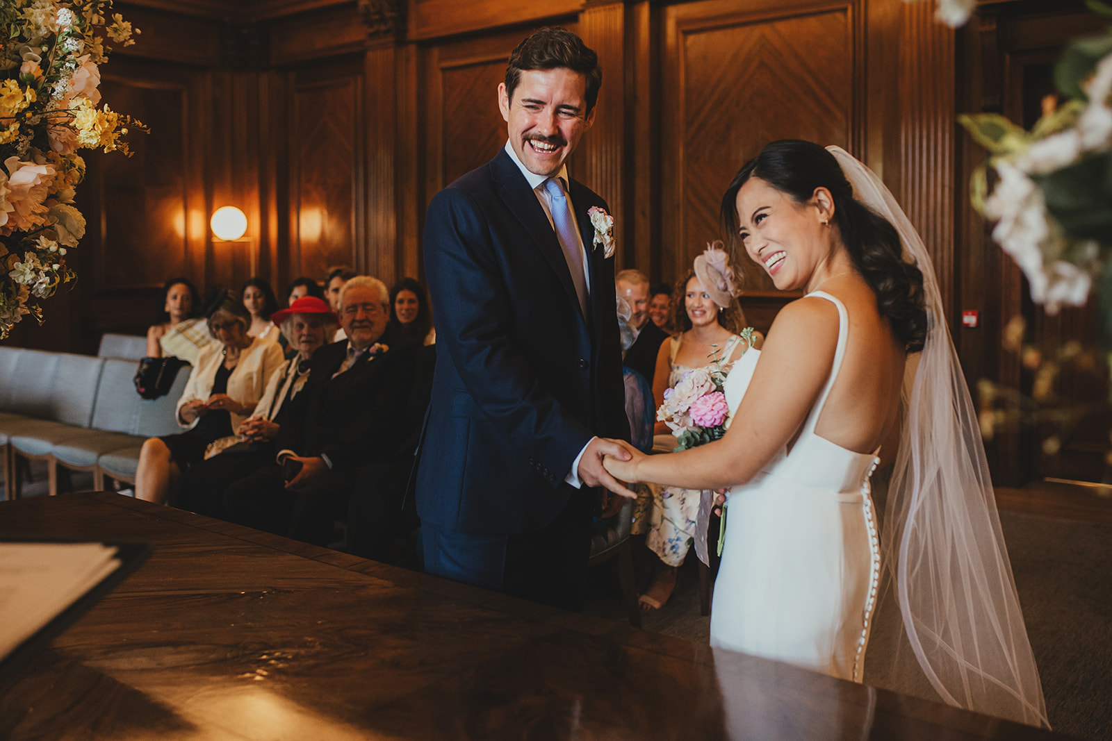 Bride and groom exchanging vows in the Westminster Room, Old Marylebone Town Hall