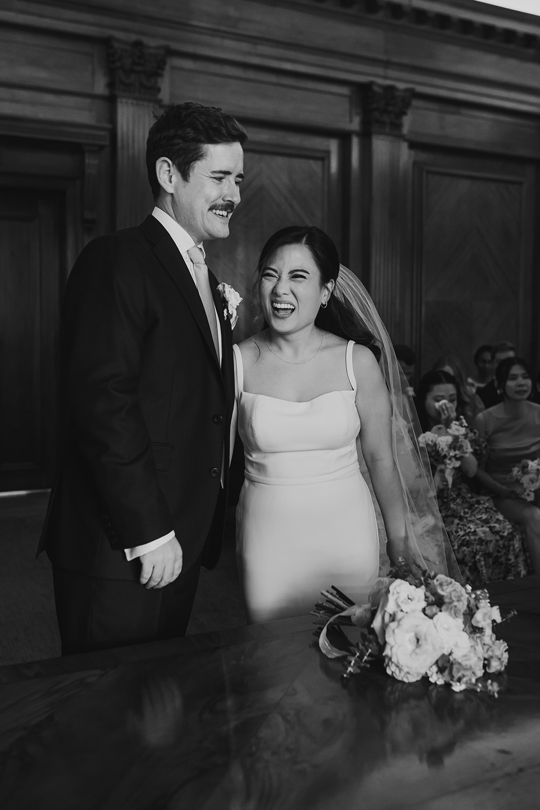 Bride laughing during the ceremony at Old Marylebone Town Hall