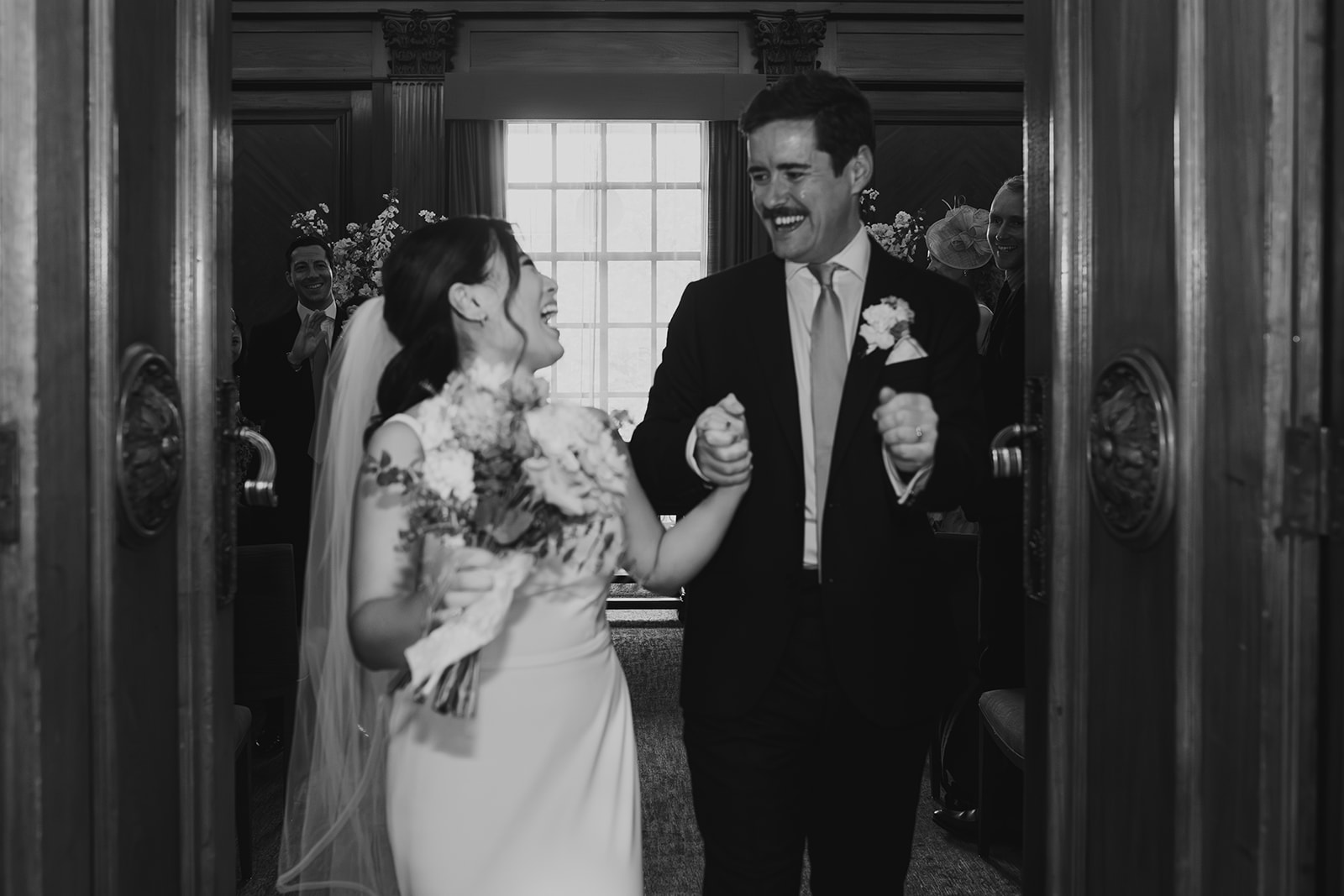 Bride and groom walking out of the ceremony, Old Marylebone Town Hall