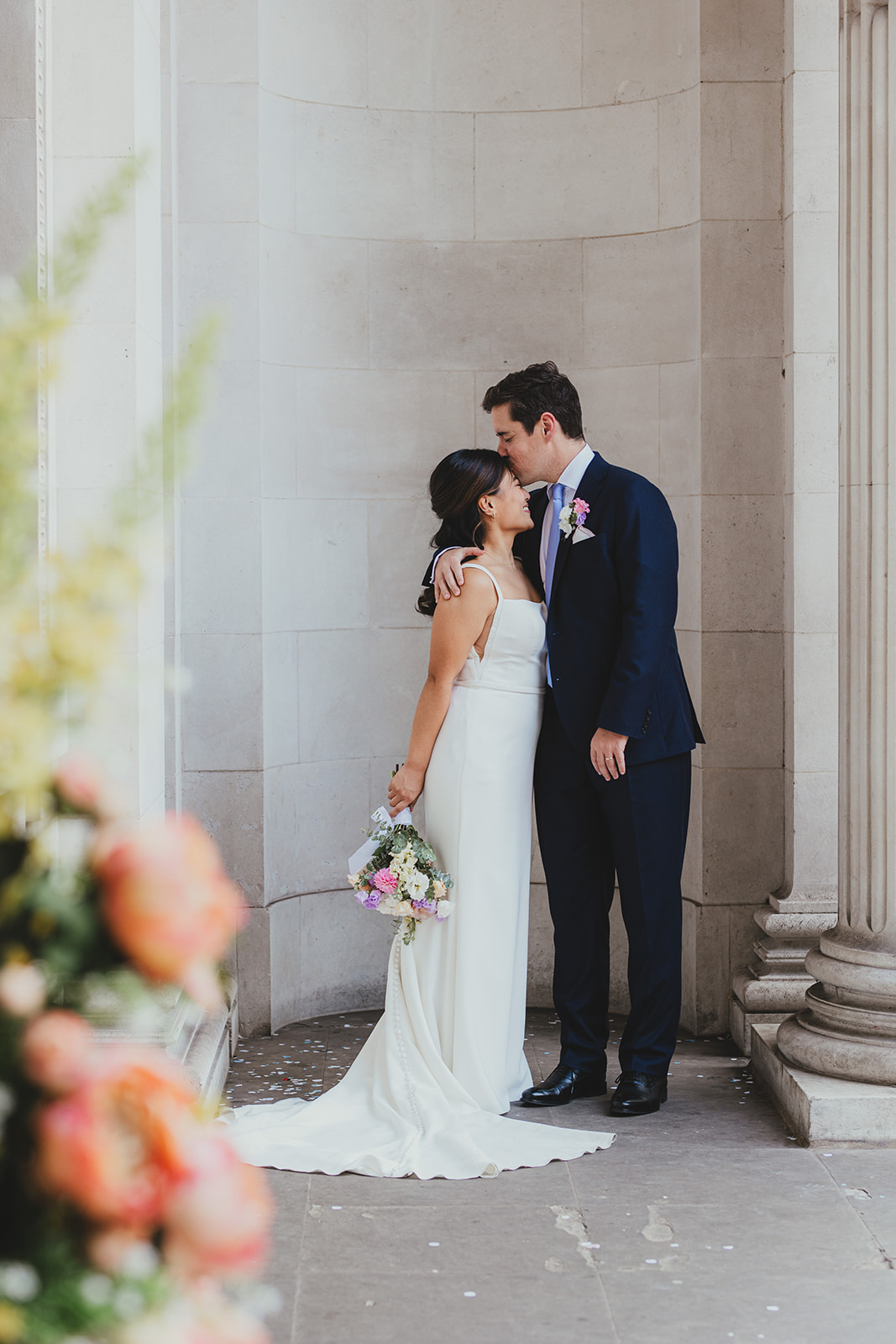 Bride and Groom Portrait in the arches outside Old Marylebone Town Hall, London