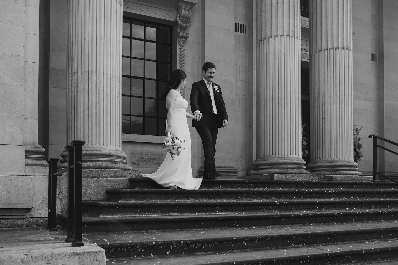 Bride and groom walking down the steps after the ceremony, Old Marylebone Town Hall