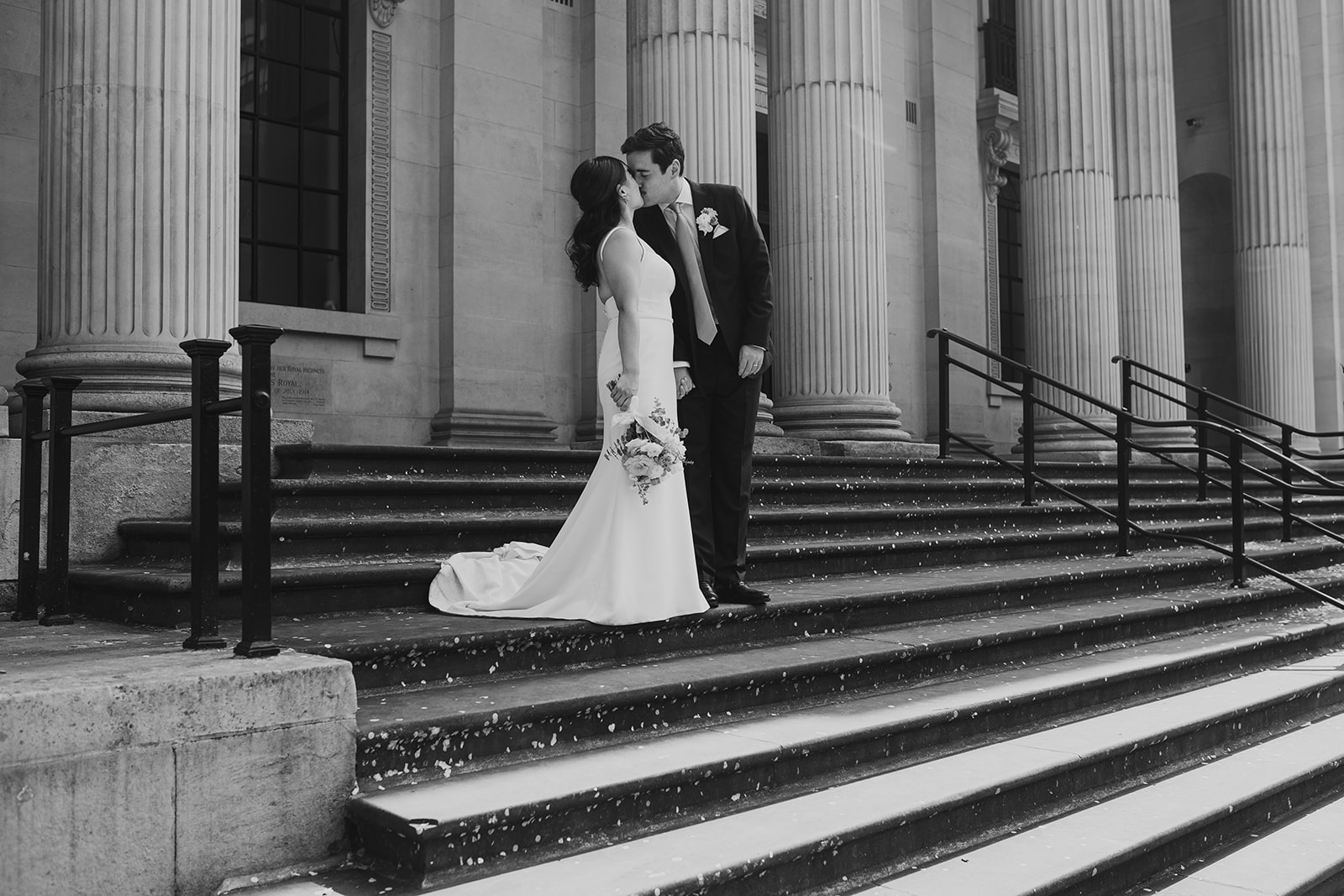 Bride and groom walking down the steps after the ceremony, Old Marylebone Town Hall