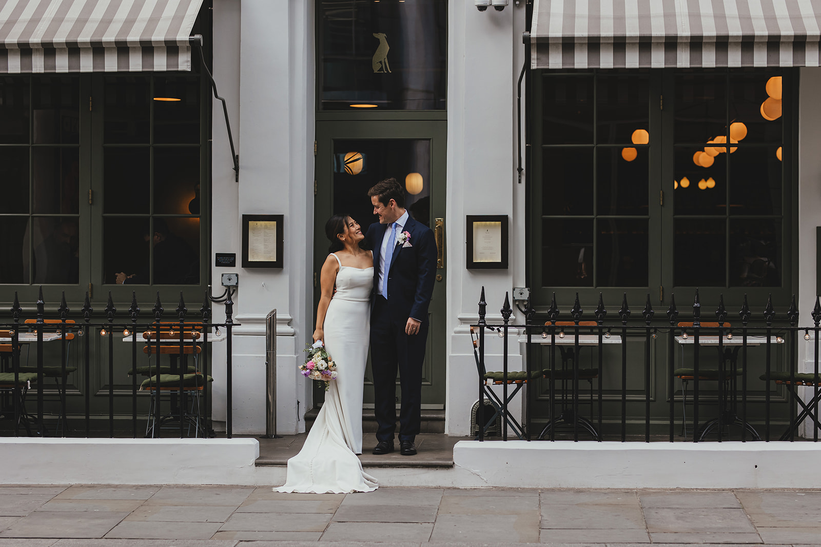 Bride and Groom outside wedding reception at The Italian Greyhound, Marylebone