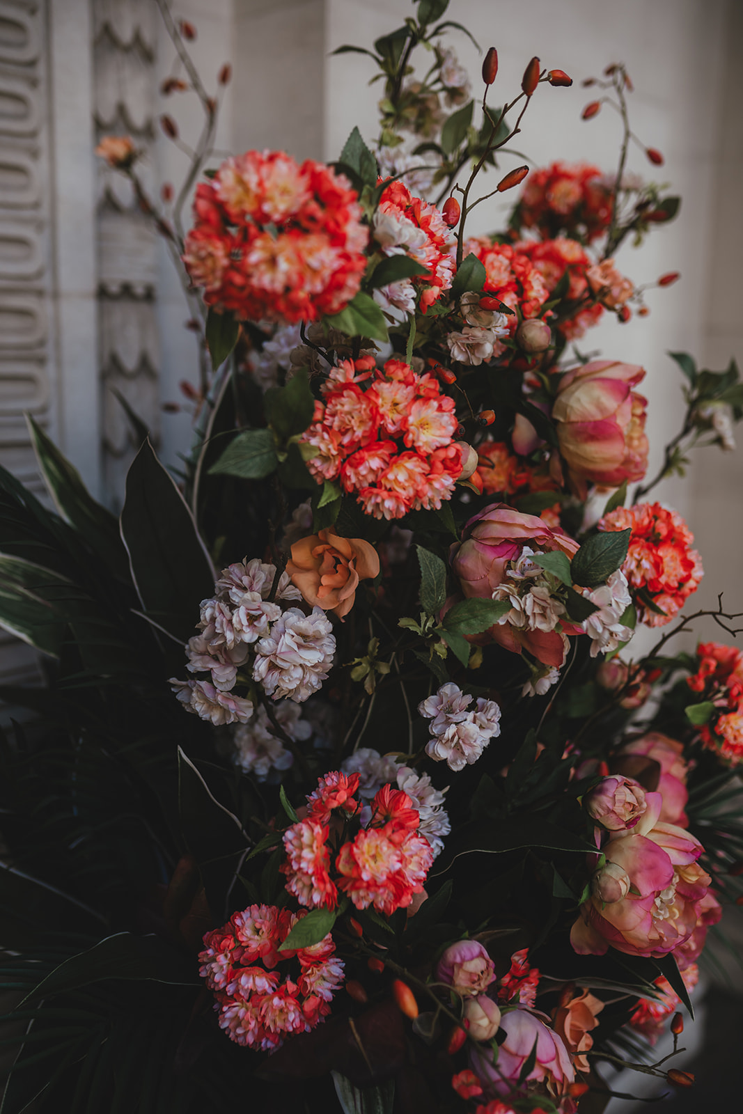 Colourful floral arrangement close-up with pink and coral blooms, Old Marylebone Town Hall