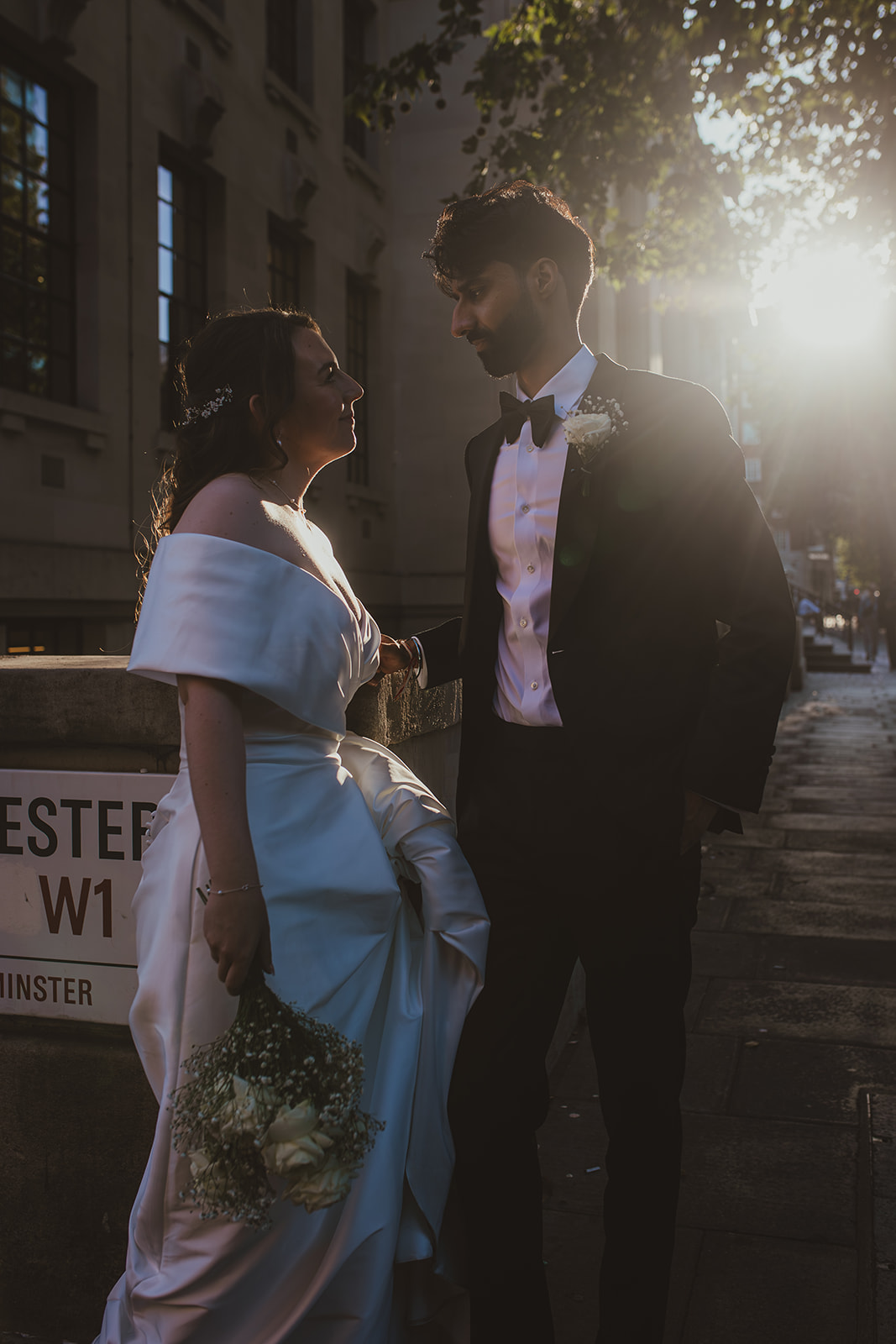 Backlit couple portrait outside Old Marylebone Town Hall at sunset, London