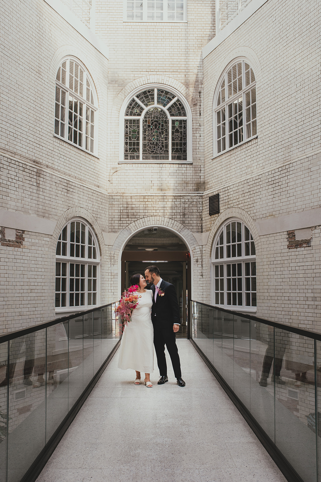 Couple standing outside Lambeth Town Hall after their London wedding ceremony, wedding portrait