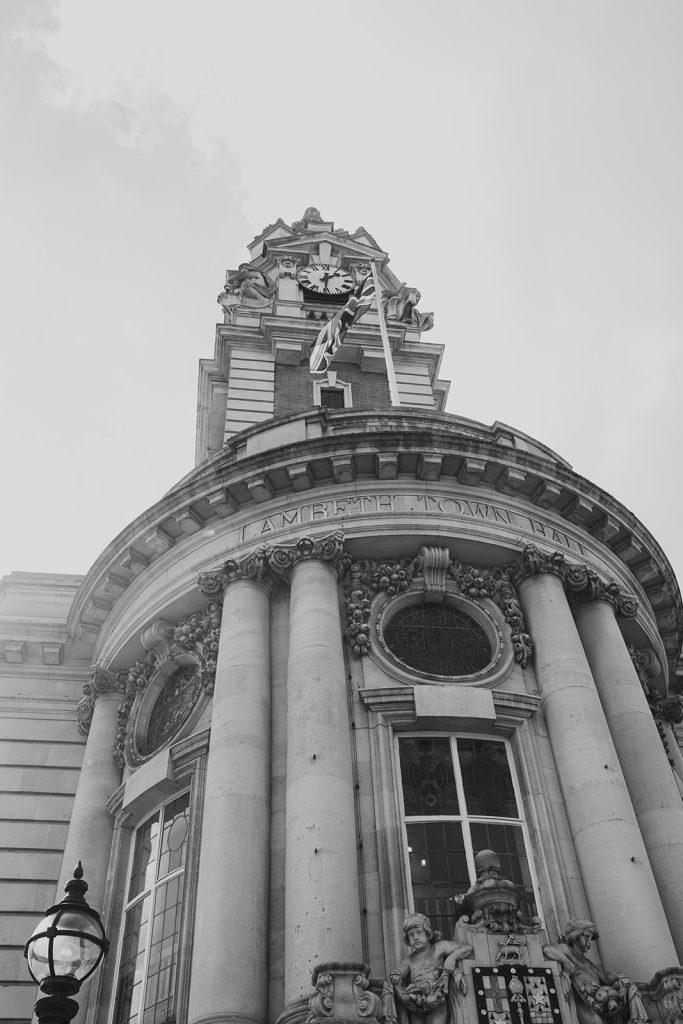 Black and white photo of the outside ofLambeth Town Hall, wedding ceremony in the Olive Morris Suite