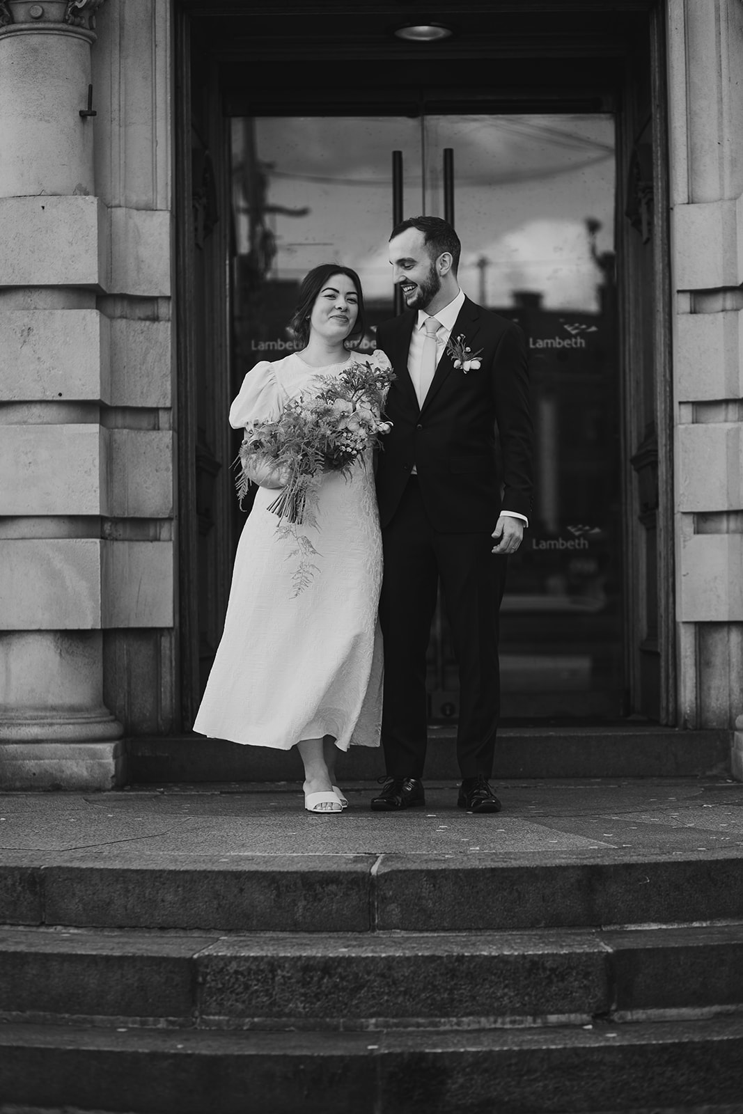 Newlyweds on the steps of Lambeth Town Hall, London