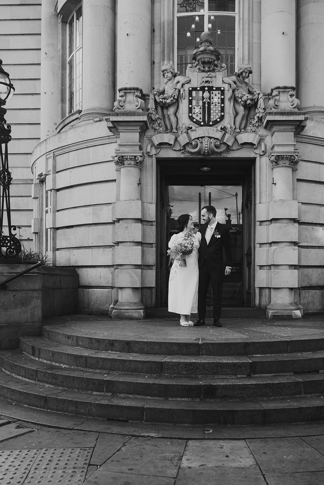 Newlyweds on the steps of Lambeth Town Hall, London