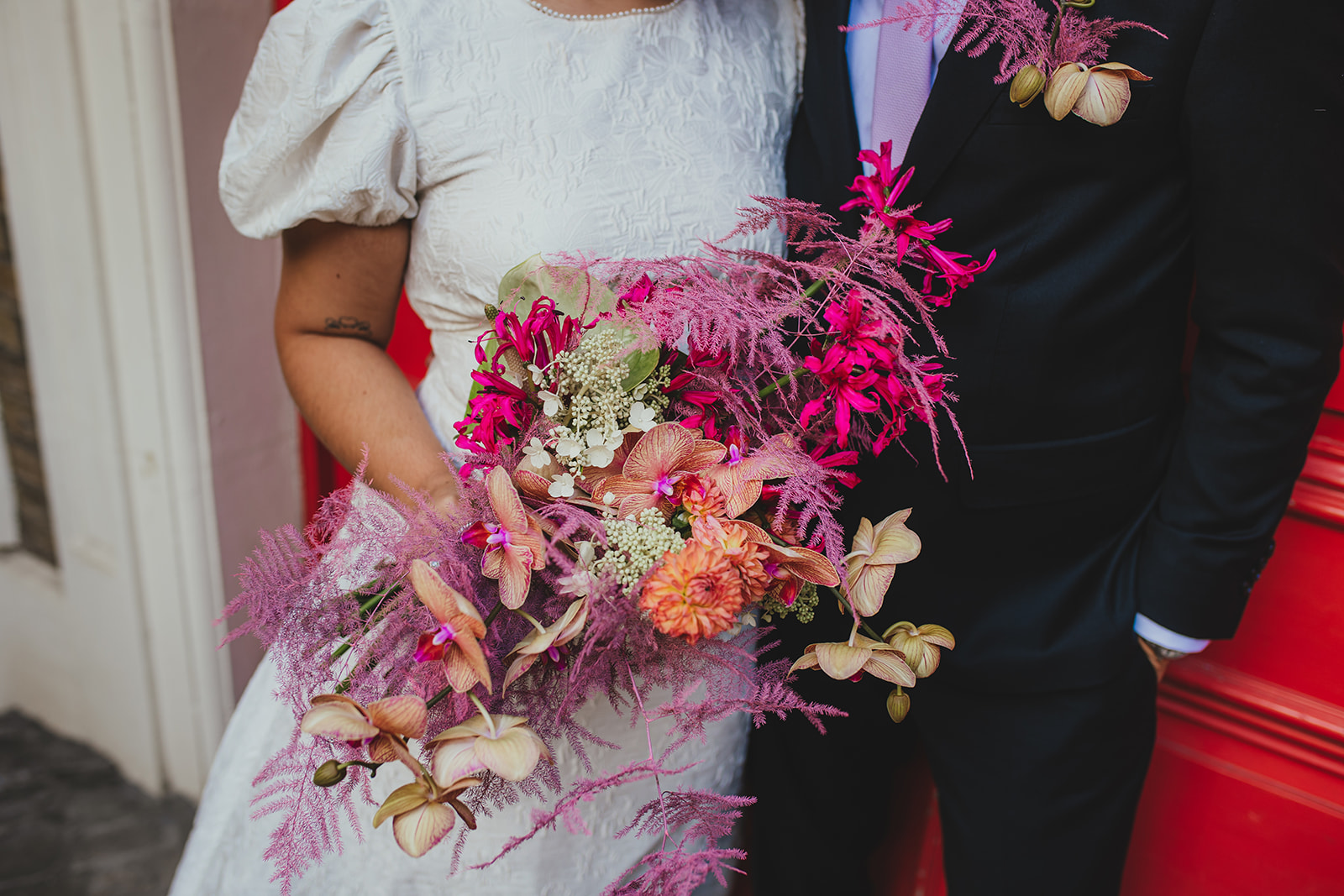 Newlyweds on the steps of Lambeth Town Hall, London