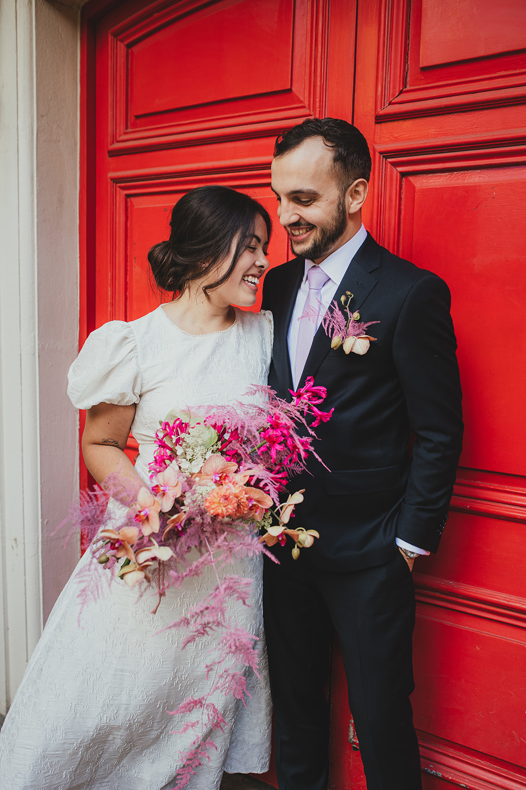Newlyweds on the steps of Lambeth Town Hall, London