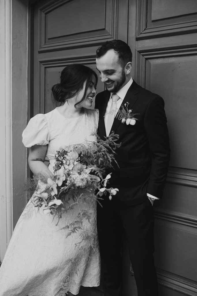 Newlyweds on the steps of Lambeth Town Hall, London
