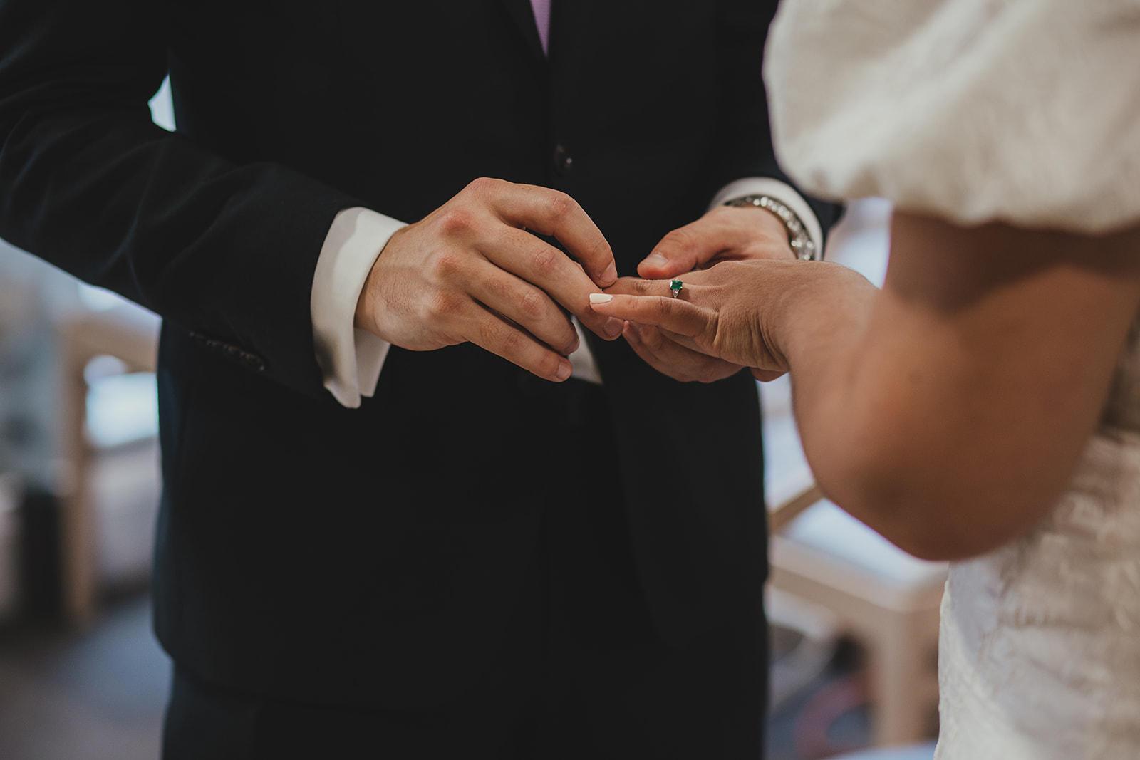 Lambeth Town Hall wedding ceremony in the Olive Morris Suite, close detail of wedding rings