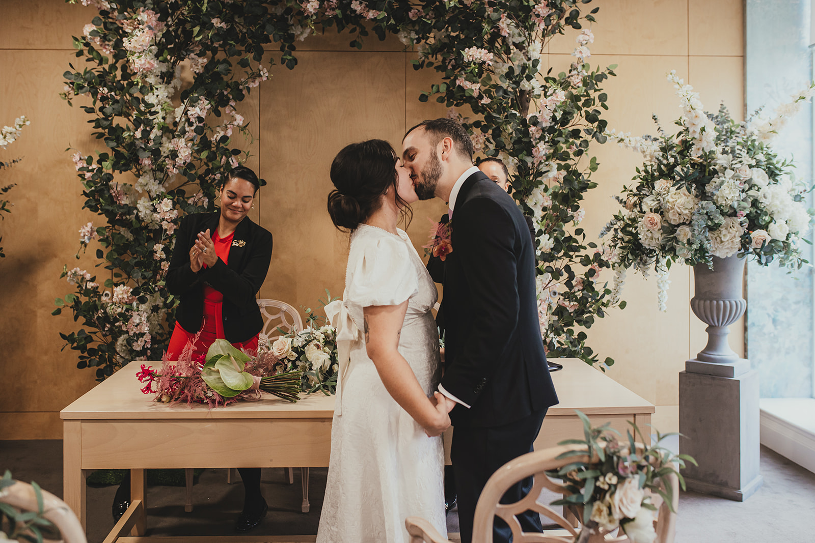 Lambeth Town Hall wedding ceremony in the Olive Morris Suite, bride and groom kissing