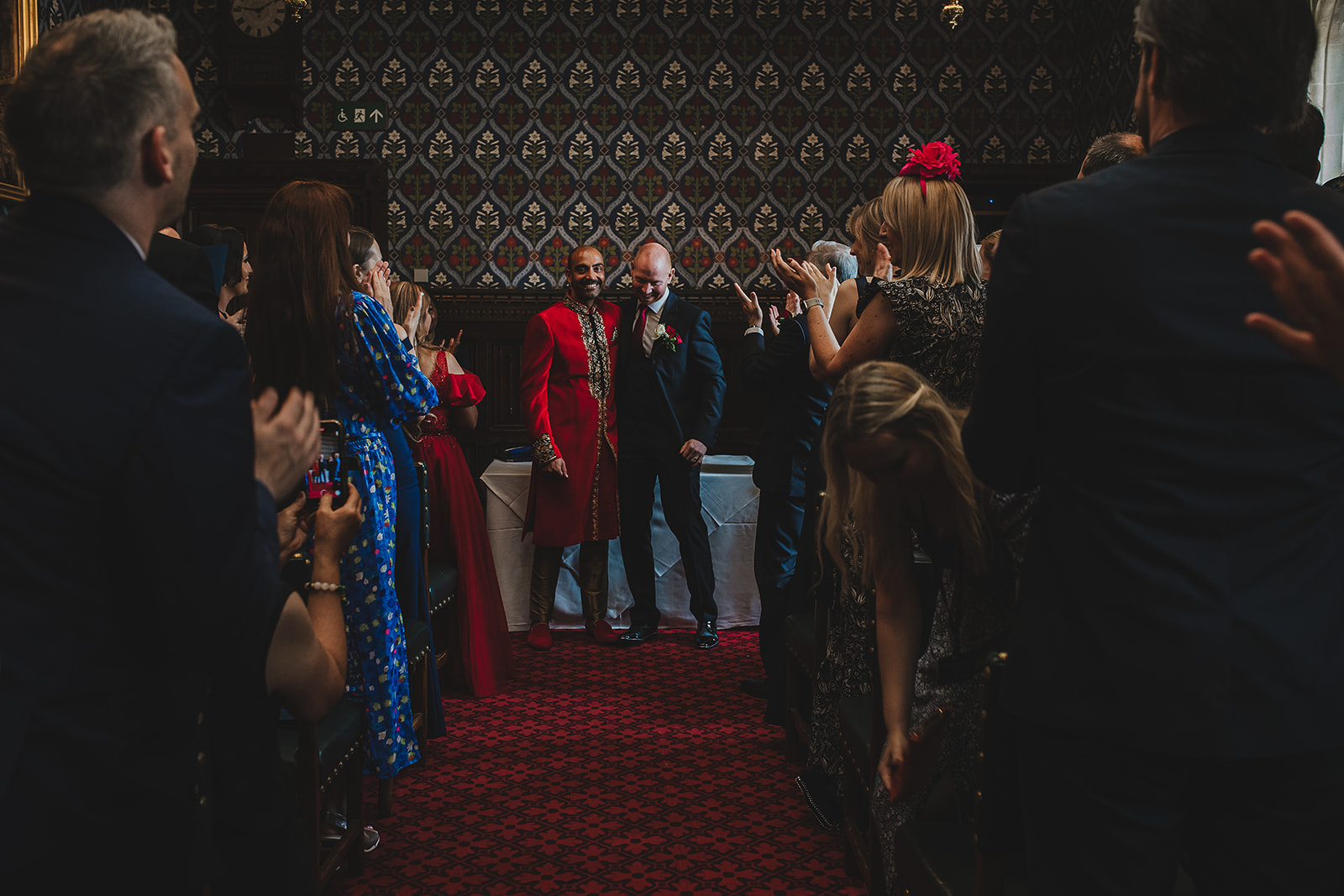 Groom and groom wedding ceremony inside the Palace of Westminster, London