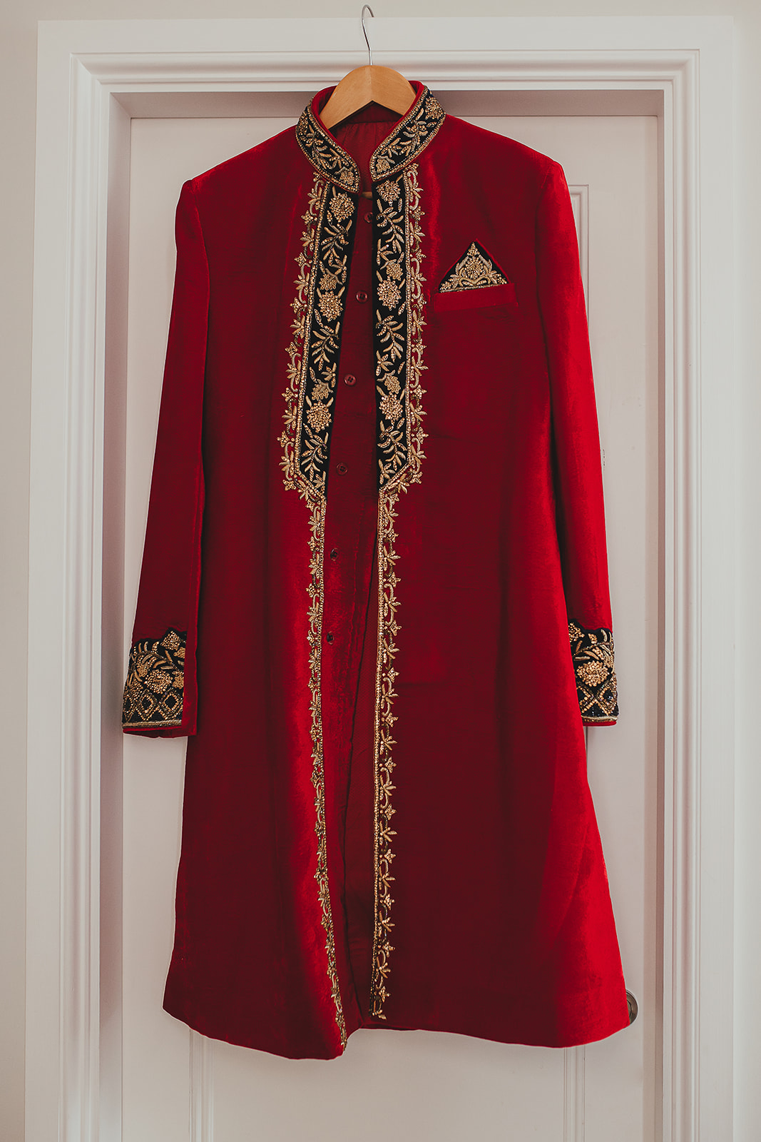 Groom's outfit hung on the door while getting ready at the Taj, London
