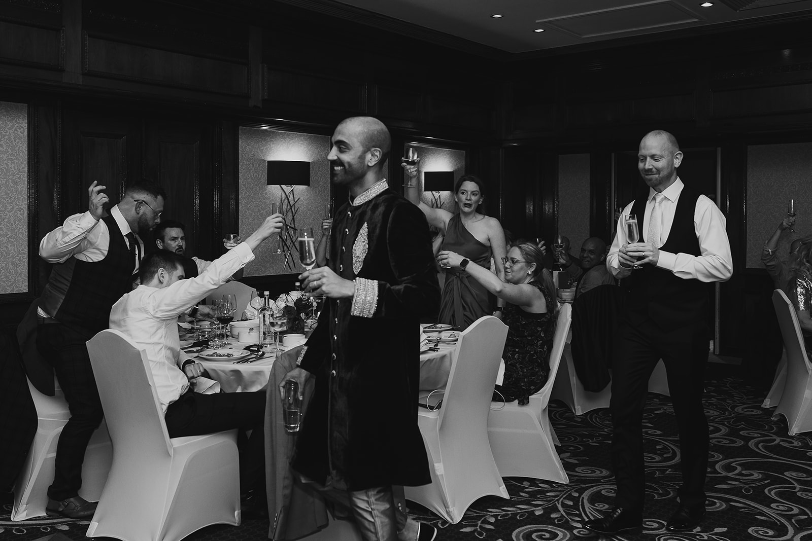 Groom and groom entering wedding reception at the Taj, London