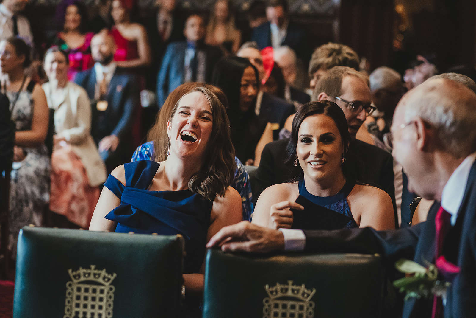 Guests laughing at wedding ceremony in Palace of Westminster