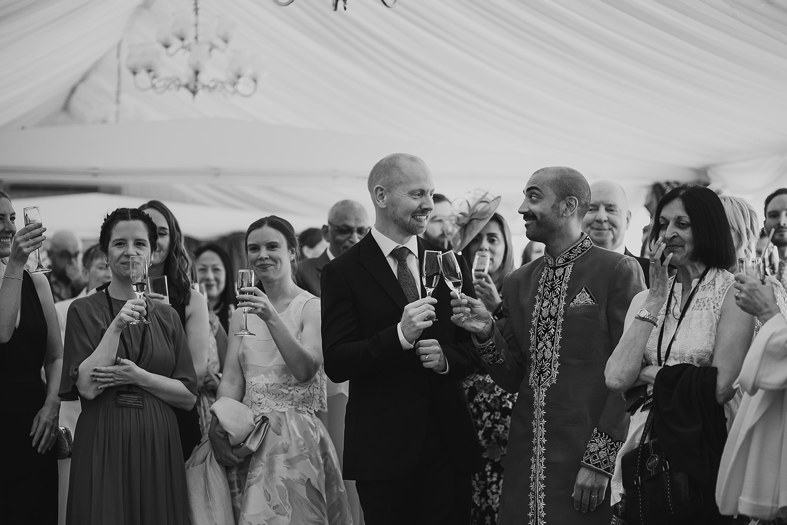 Guests with groom and groom at drinks reception at the Palace of Westminster