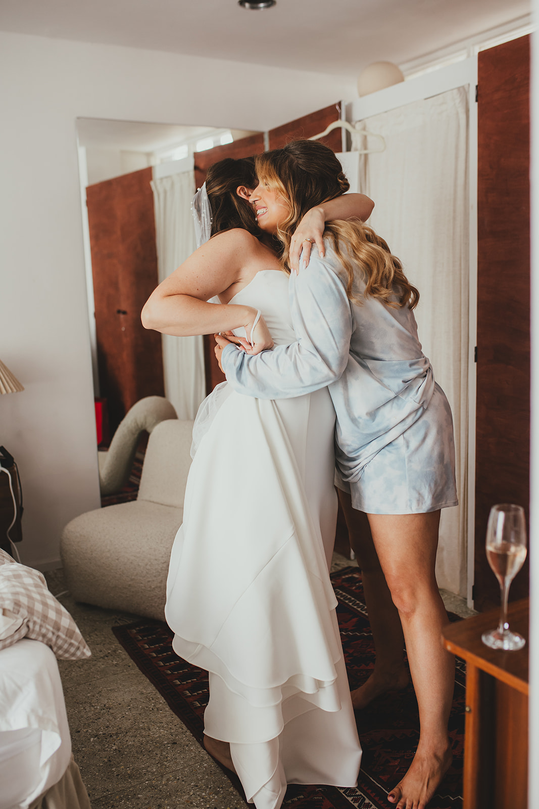Bride hugging bridesmaid, Wedding morning preparations, London wedding, Islington Town Hall wedding
