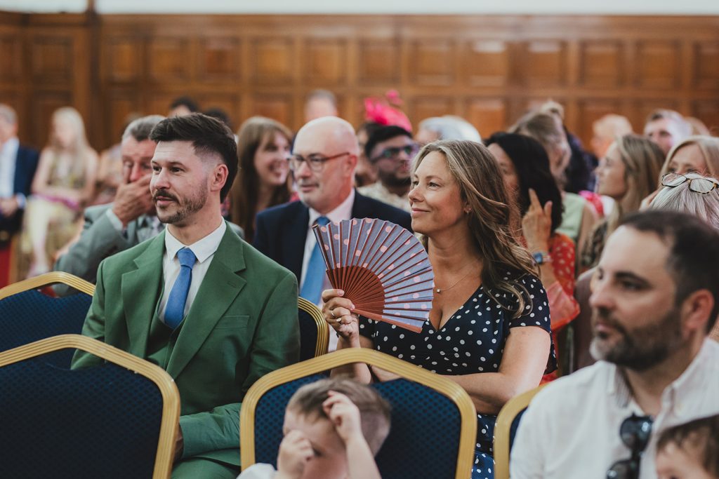 Guests waiting for ceremony to start at Islington Town Hall, London wedding