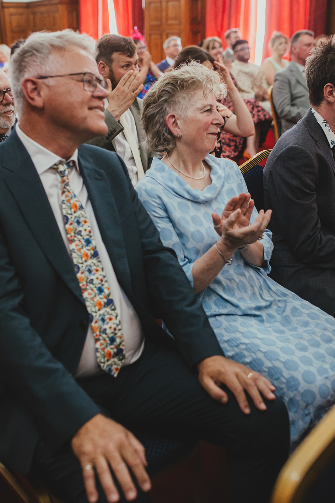 Guests watching and clapping during wedding ceremony, London wedding, Islington Town Hall