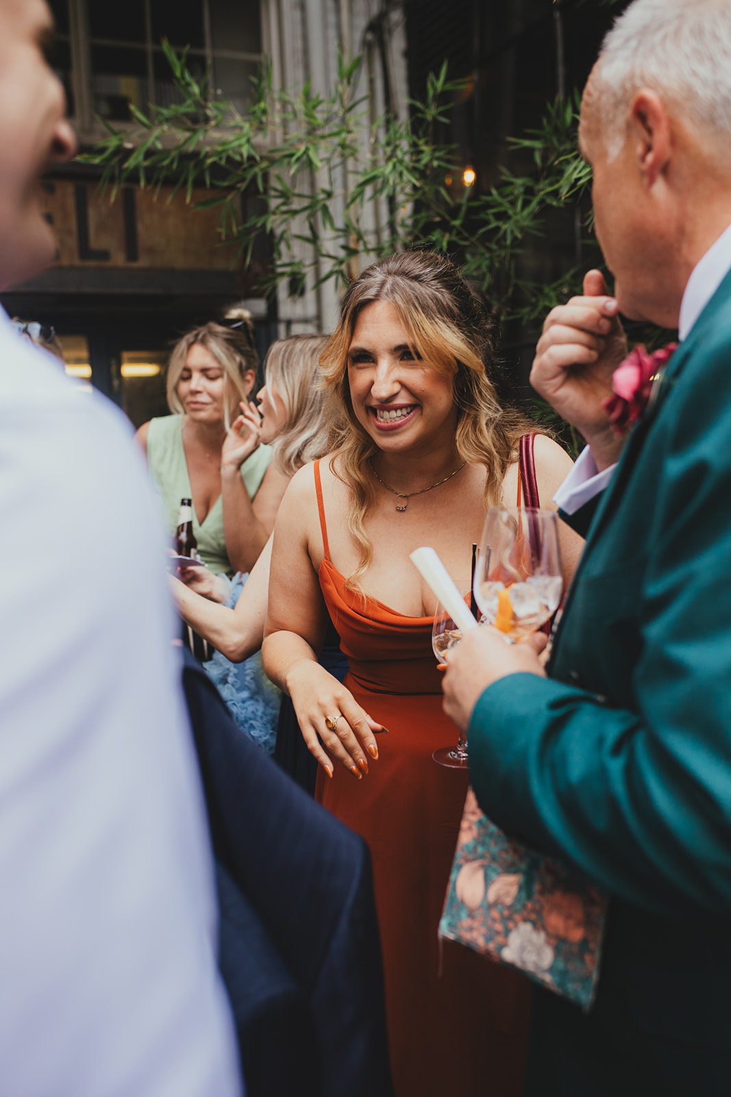 Guest laughing in court yard at The Depot N7 wedding reception, London wedding