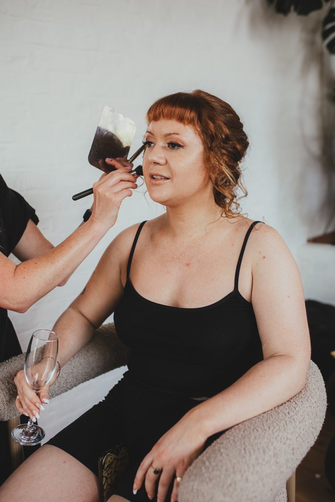 Bridesmaid having makeup done, Wedding morning, London wedding, Islington Town Hall wedding