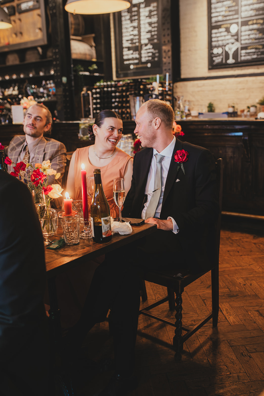 Guests reactions during wedding speeches at The Depot N7 wedding reception, London wedding