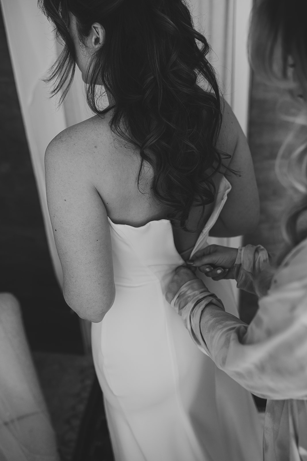Bride getting into wedding dress, London wedding, Islington Town Hall wedding