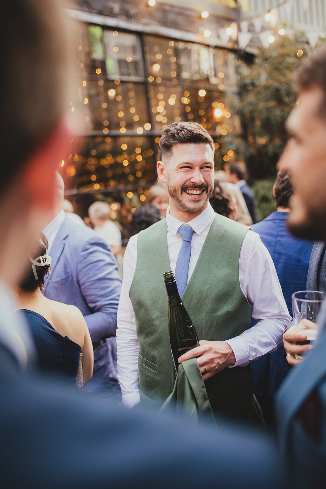 Guests laughing at The Depot N7 wedding reception, London wedding