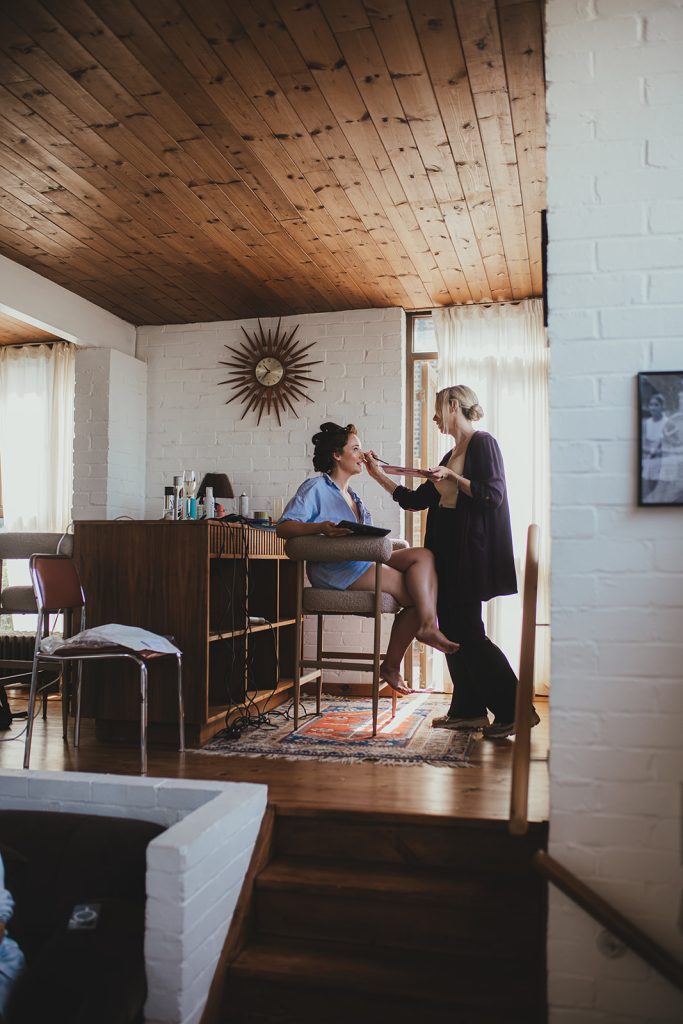 Bride getting ready in mid century modern home, London wedding