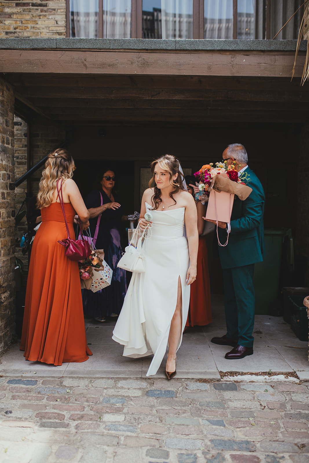 Bride leaving fro the ceremony at Islington Town Hall, London wedding