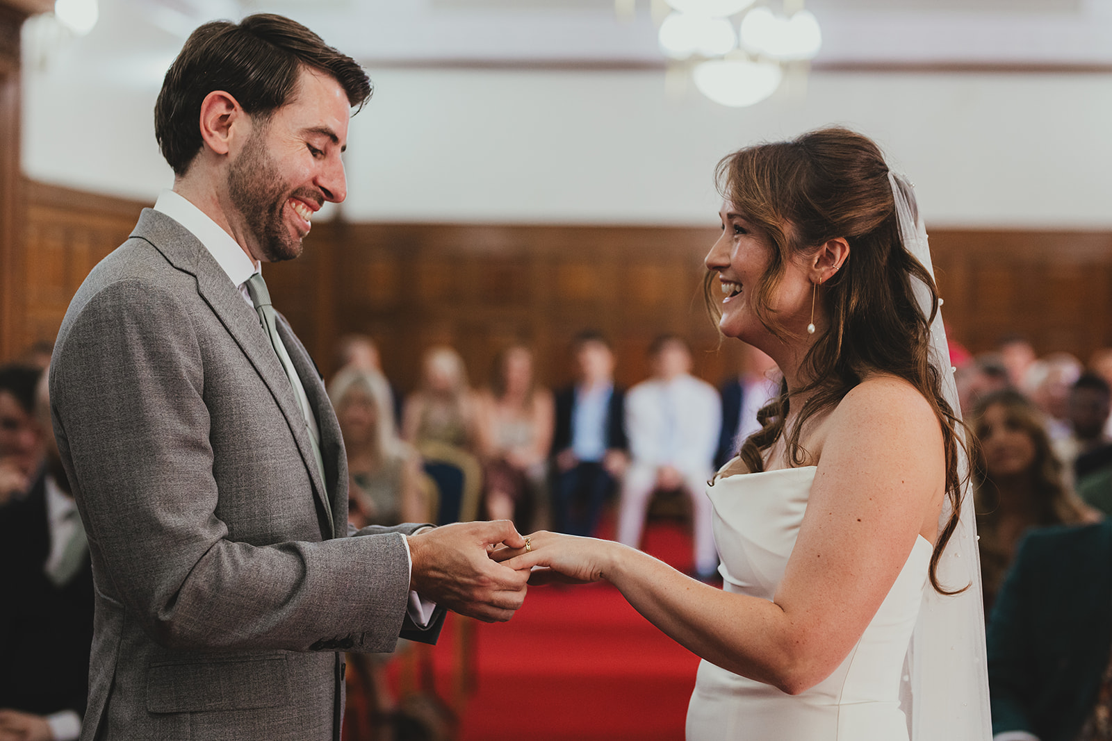 Bride and groom exchanging rings at Islington Town Hall wedding, London wedding