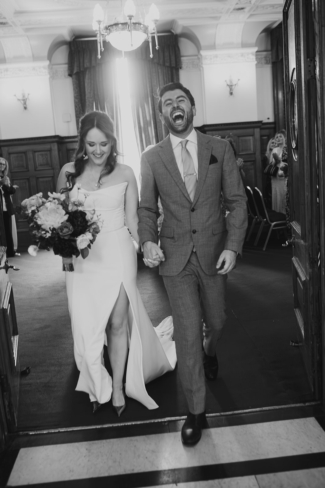 Bride and Groom leaving ceremony after being married at Islington Town Hall, London wedding