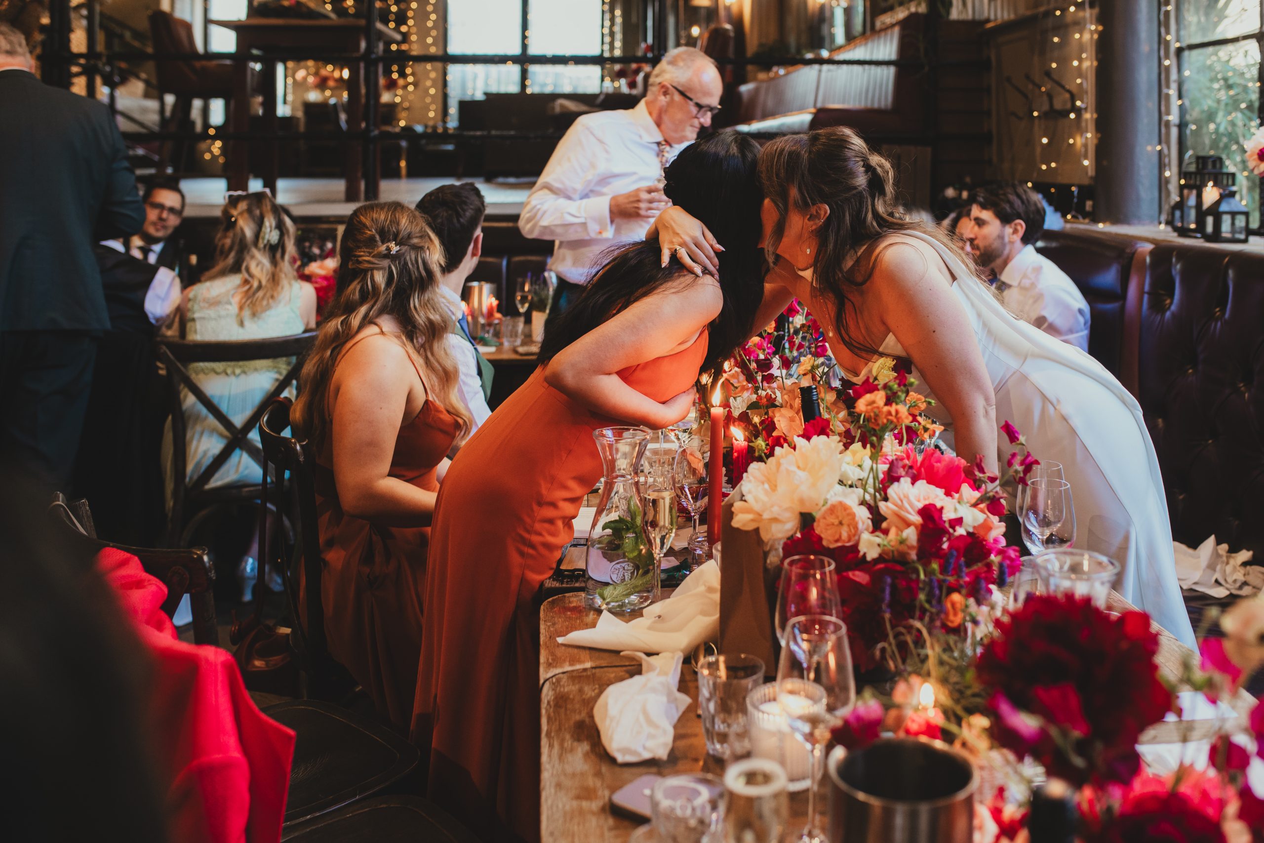 Guests reactions during wedding speeches at The Depot N7 wedding reception, London wedding