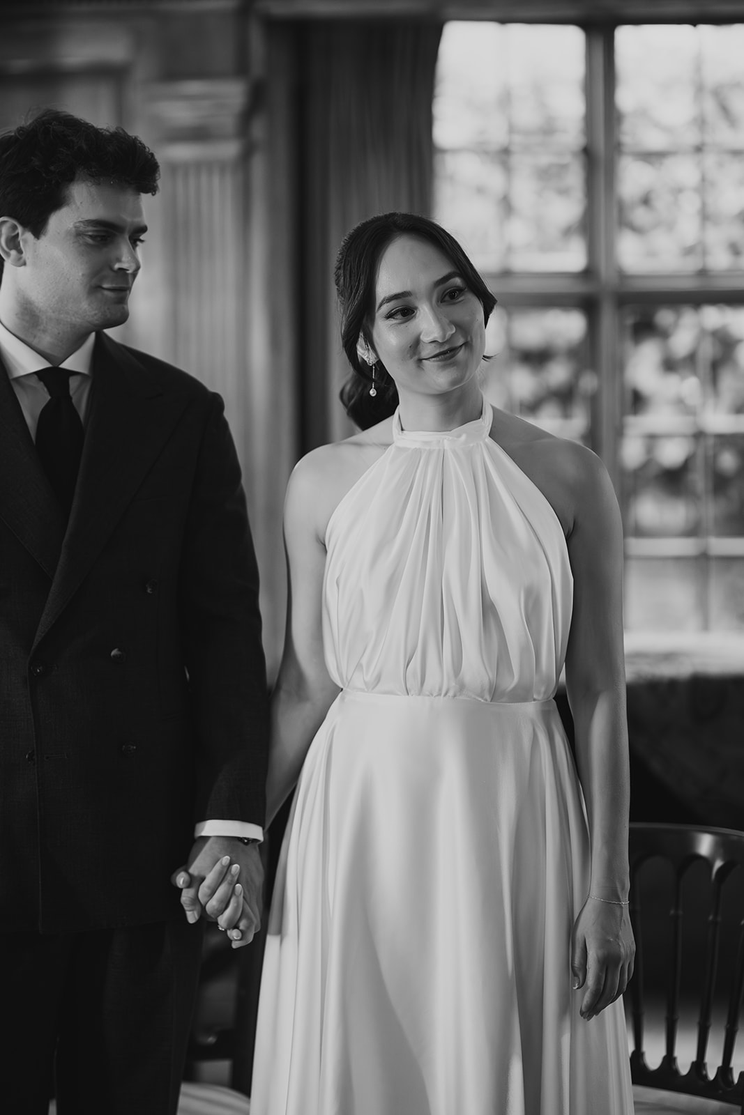 The groom looking at the bride during their wedding ceremony in Hampstead Heath