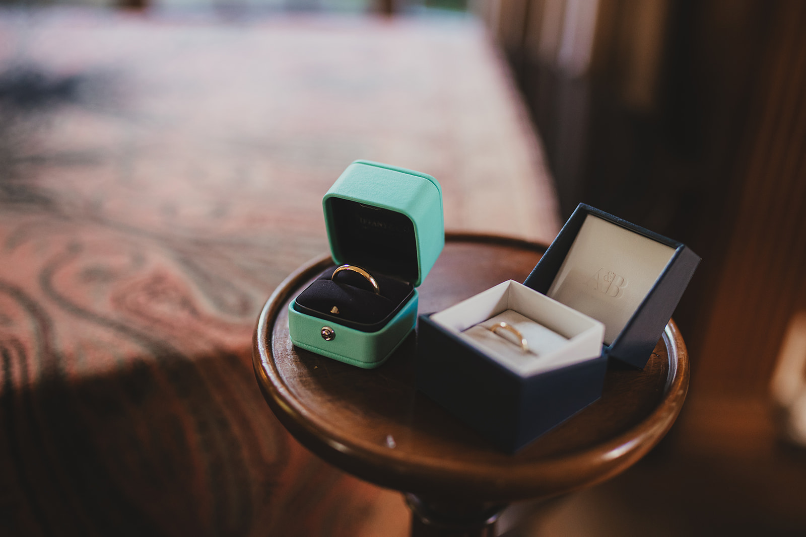 The rings on a small side table ready for the ceremony