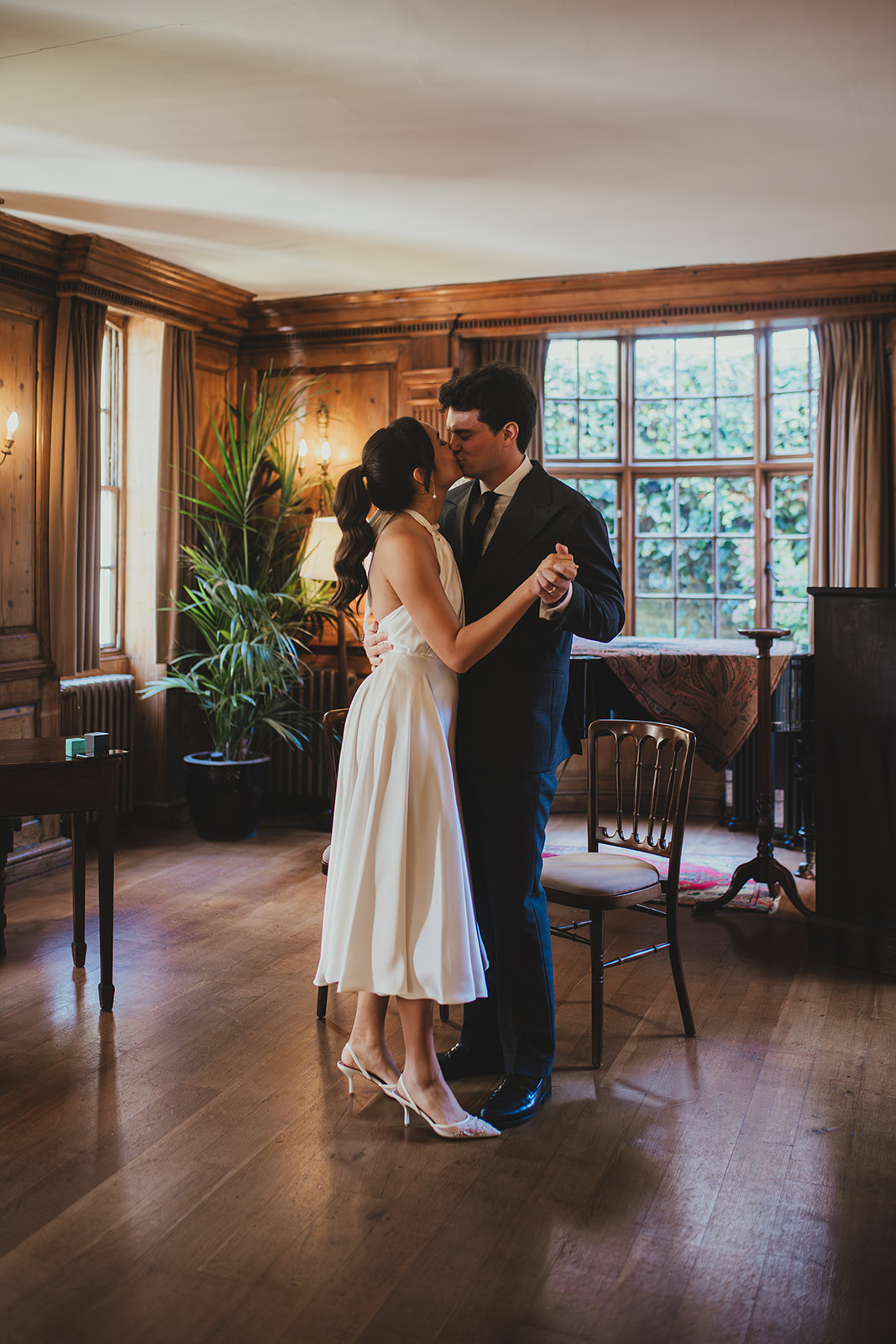 Bride and groom dancing in the music room at Burgh House 