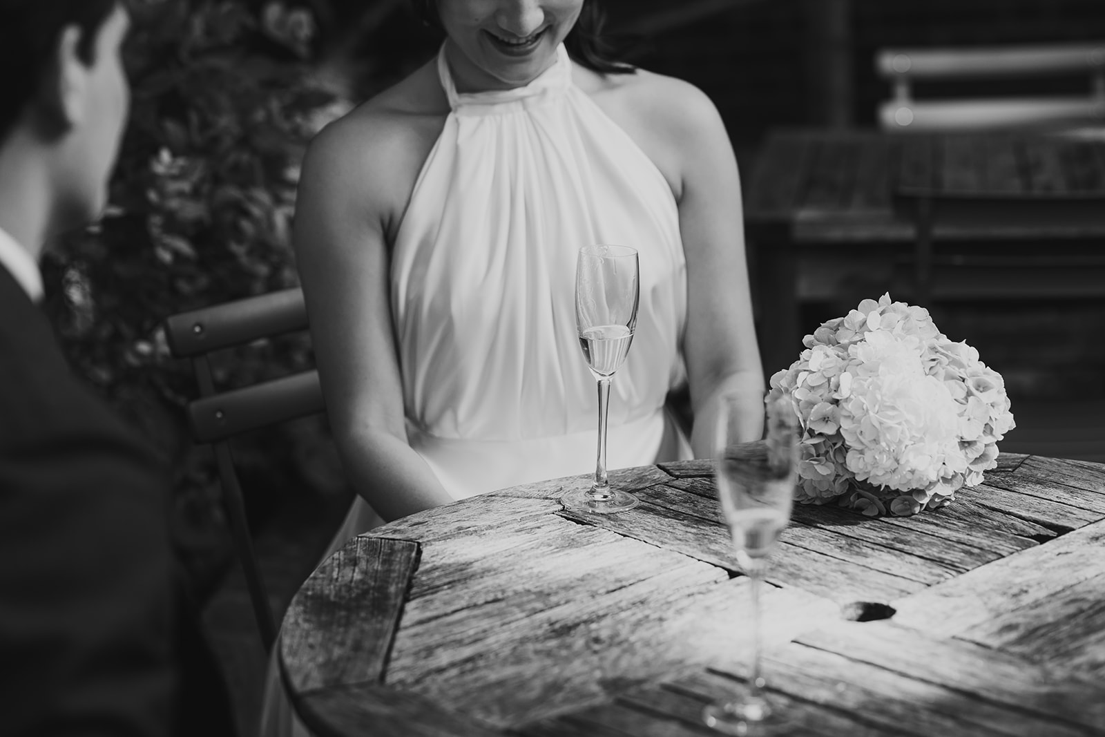 detail shot of bride and groom having drinks 